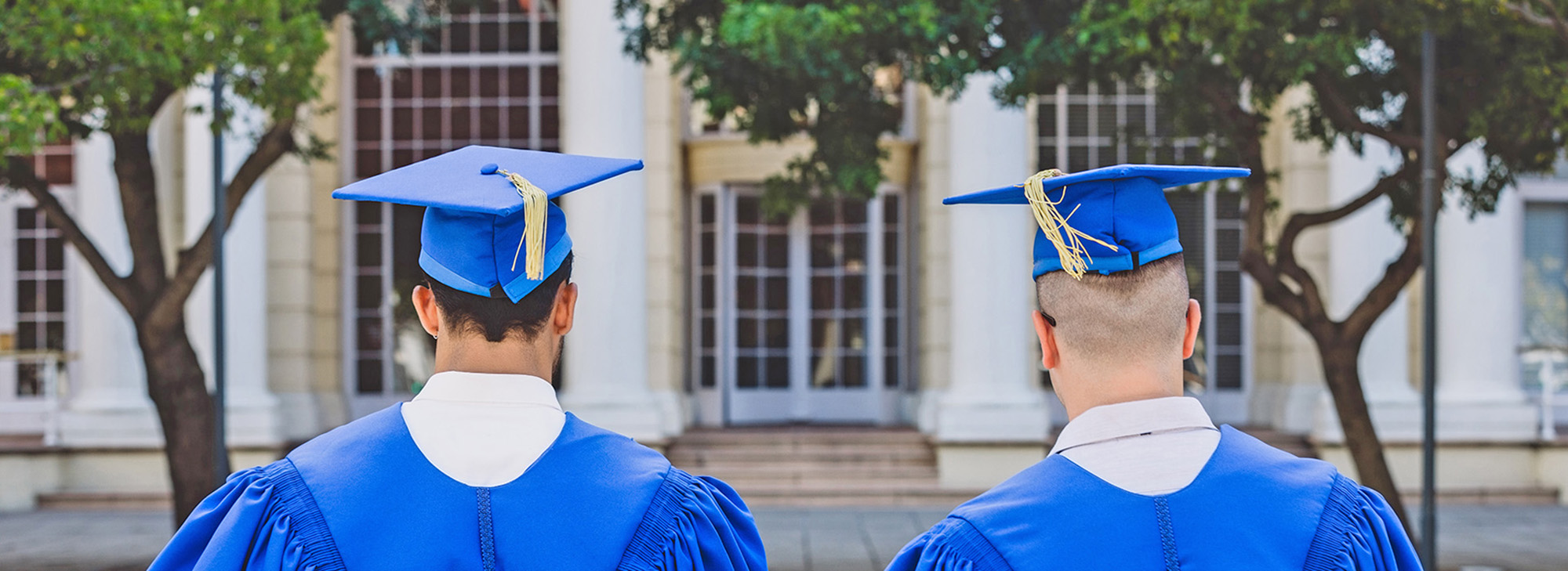 Rearview shot of two young men on graduation day