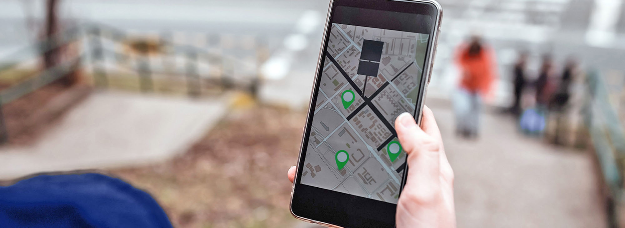 Person using map in phone app to navigate and find GPS location service