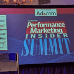 Slide on TV that reads "Performance Marketing Insider Summit"