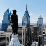 An image of the Philadelphia skyline featuring the William Penn statute atop City Hall.