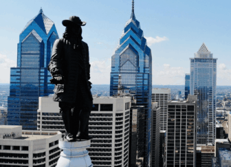 An image of the Philadelphia skyline featuring the William Penn statute atop City Hall.