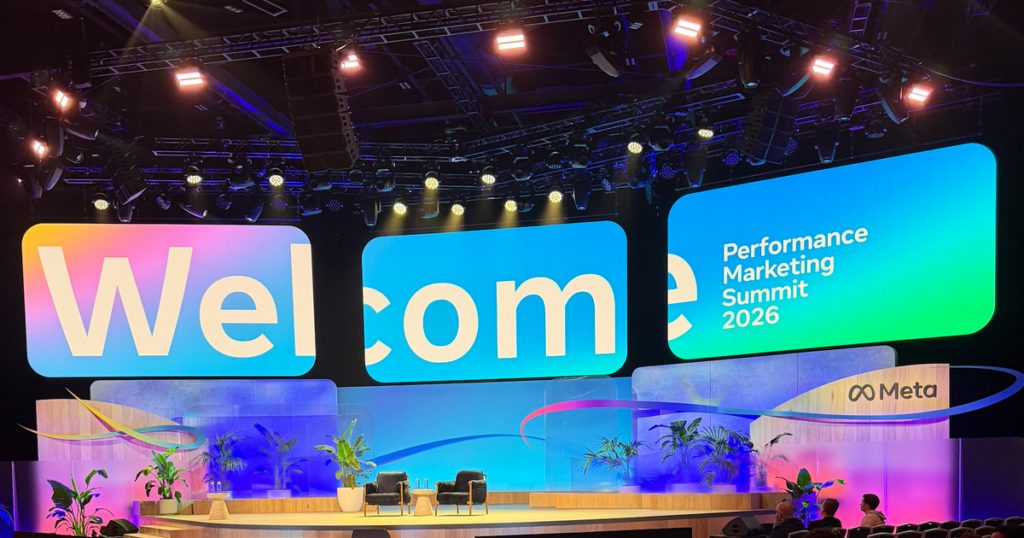 Conference stage with large screens displaying “Welcome” and “Performance Marketing Summit 2026.”